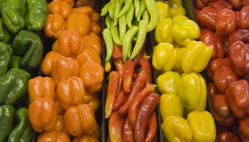Vegetables stacked on supermarket shelf