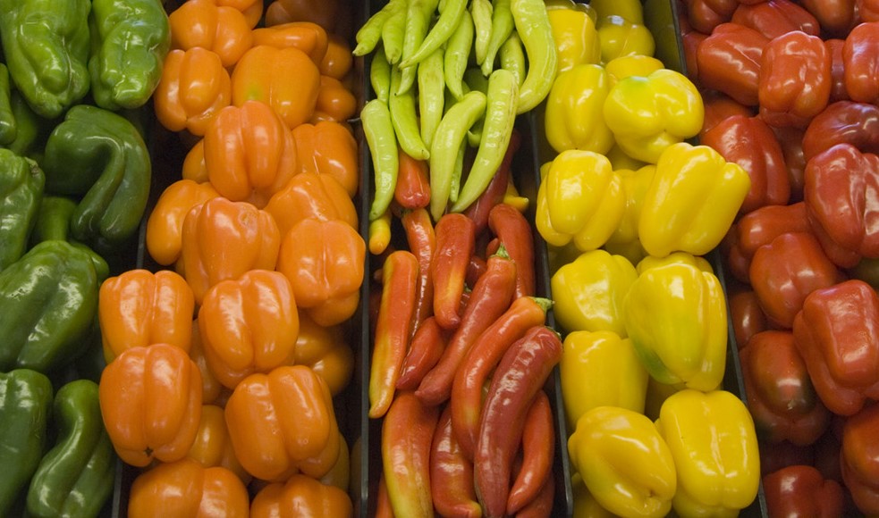 Vegetables stacked on supermarket shelf