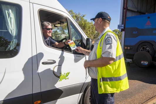 Quarantine WA border inspector taking to driver at Kimberley checkpoint