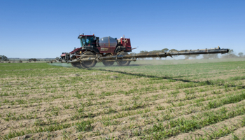 Self propelled boom sprayer in field