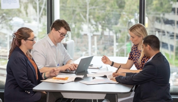 People at a table having a meeting