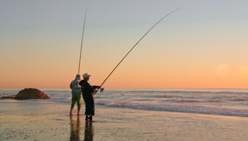 Two people beach fishing