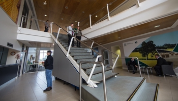 A group of people standing on a staircase.